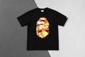 BAPE 1ST CAMO BY BATHING APE TEE – Black/Orange
